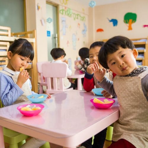 Happy children playing in kindergarten